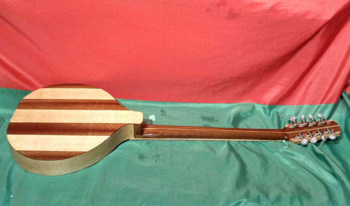 Back and side view of 4 course version with back, sides anc neck of Maple and Sapele.