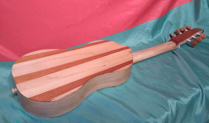 Side view from back of renaissance guitar with pegbox instead of peghead. Back and sides of English Elm and Meranti.