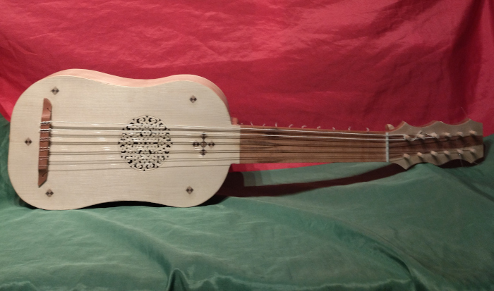 Front view of vihuela with alternative soundboard inlays and fingerboard and bridge of Goncalo Alves.
